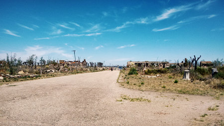 Abandoned city, desert, ruined buildings sky blue cloudsの写真素材