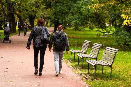 A man is walking while speaking on the phone at the convention trade center in Brno taking some time to have a coffee. BVV Brno Exhibition center. Czech Republicのeditorial素材