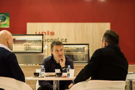 Man is walking alone in Prague 7 district carrying her shopping bags during quarantine period due to outbreak of COVID-19 as winter is starting, Czech Republicのeditorial素材