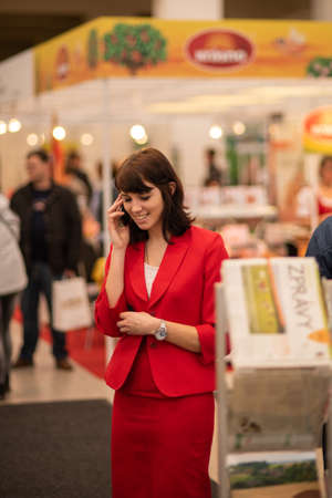 A waitress is serving coffee to a clients at the convention trade center in Brno. BVV Brno Exhibition center. Czech Republicのeditorial素材
