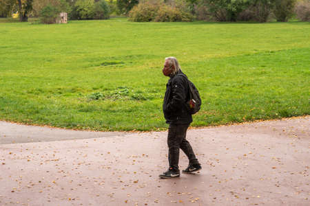 Family with mask is crossing the street at Hradcanska metro station during quarantine period due to outbreak of COVID-19 as winter is starting. Prague, Czech Republicのeditorial素材
