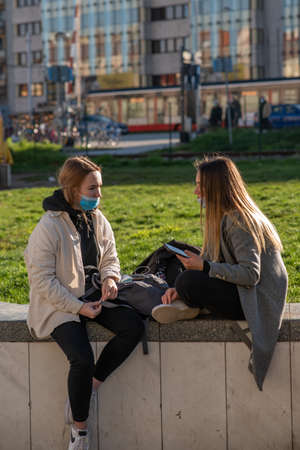 11-23-2020. Prague, Czech Republic. People walking and talking outside during coronavirus (COVID-19) at Hradcanska metro stop in Prague 6. Man in bike.のeditorial素材