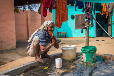 Woman in India has many responsibilities as taking care of their children, cooking, washing, working, also receiving training for income generating activitiesのeditorial素材