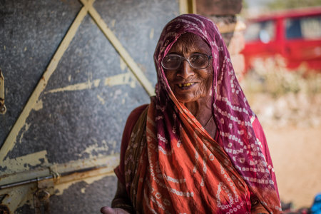 Old woman in India receiving treatment from a doctor who work for a Non government organization.のeditorial素材