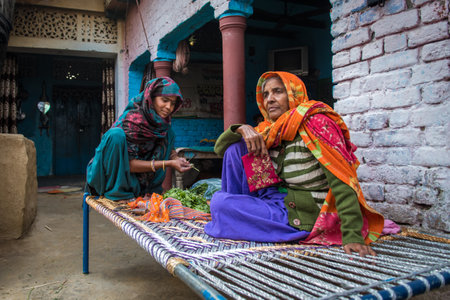 Woman in India has many responsibilities as taking care of their children, cooking, washing, working, also receiving training for income generating activitiesのeditorial素材