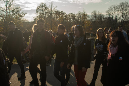 Editorial â December 15thPrague, Czech Republic. 01-11-2020. Tourists are walking on the Charles Bridge on the Historical town. Couple checking their cellphone on charles bridge.のeditorial素材