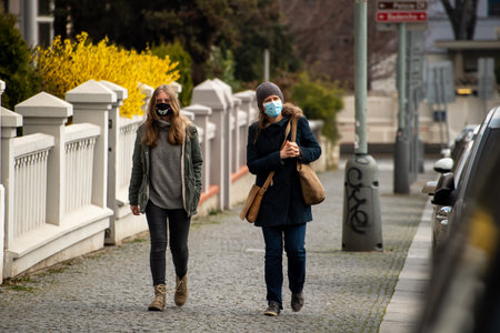 Editorial â December 15thPrague, Czech Republic. 01-11-2020. Tourists are walking on the Charles Bridge on the Historical town.Man selling on his gift shop at the charles bridge.のeditorial素材