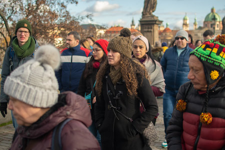 Prague, Czech Republic. 01-11-2020. Tourists are walking on the Charles Bridge on the Historical town in Prague. Crowded scene at the Charles Bridge in Prague.のeditorial素材