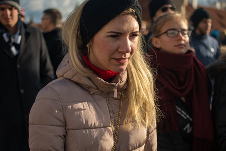 Prague, Czech Republic. 01-11-2020. Tourists are walking on the Charles Bridge on the Historical town in Prague. Close up of a young woman at the Charles Bridge in Prague.のeditorial素材