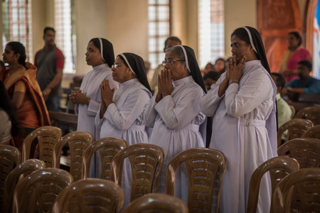 Kerala, India, 08-12-2017. Nuns during ceremony. Catholic wedding in the Province of Kerala in South India. Religious celebration at church.のeditorial素材