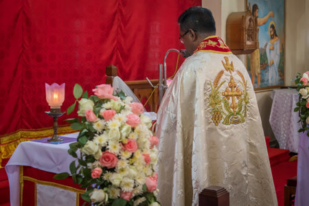 Kerala, India, 08-12-2017. Priest preparing fro the ceremony. Catholic wedding in the Province of Kerala in South India. Religious celebration at church.のeditorial素材