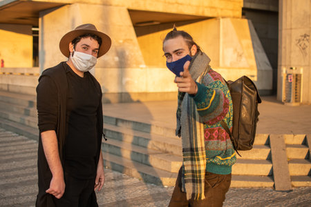 Prague, Czech Republic. 03-08-2020. Young male friends enjoying looking at the camera. In Prague,...