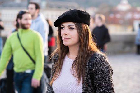Prague, Czech Republic. 09-23-2019. Portrait of elegant young beautiful woman on the Charles Bridge during a sunny day in Prague.のeditorial素材