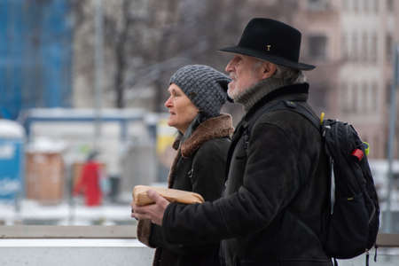 Prague, Czech Republic. 02-08-2021. Man and woman are walking in the city center of Prague on a cold...
