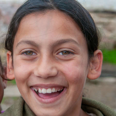 5-16-2018. Lomnicka, Slovakia. A close-up of Roma or Gypsy smiling girl in an abandoned community in the heart of Slovakia, living in miserable conditions.のeditorial素材