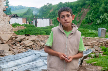 05-16-2018. Lomnicka, Slovakia. Roma or Gypsy child living in an abandoned community in the heart of Slovakia, living in miserable conditions.のeditorial素材
