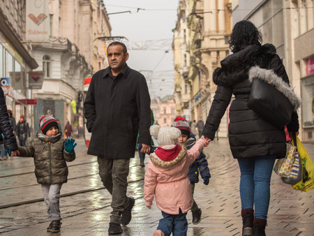 Brno, Czech Republic. 02-17-2021. Mother father and children walking on Masarykova street in the city of Brno on cold winter day.のeditorial素材