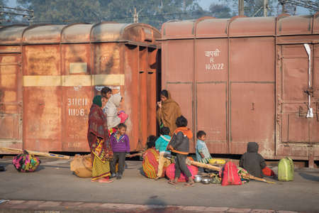 Varanasi. India. 11-02-2018. A family is having breakfast and washing teeth at the Varanasi train...