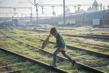 Varanasi. India. 11-02-2018. A lonely boy working at the Varanasi train station.のeditorial素材