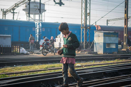 Varanasi. India. 11-02-2018. A lonely boy working at the Varanasi train station.のeditorial素材