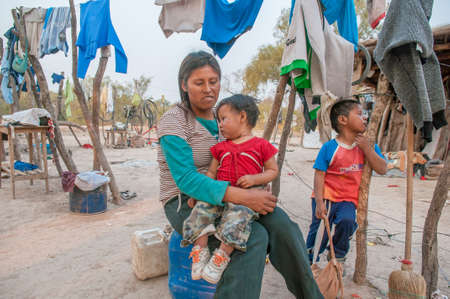 Chaco. Argentine. 15-01-2019. Indigenous mother with her 2 boys in Chaco Province, in the North of...
