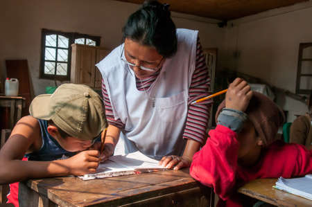 Chaco Province. Argentine. 15-01-2019. Indigenous teacher helping students with homework at school...