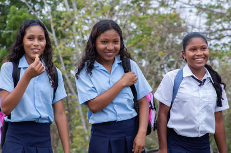 Darien Province, Panama. 07-18-2019. Indigenous female adolescents with school uniform laughing in the Darien Province, Panama, Central America,のeditorial素材