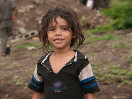 Managua, Nicaragua. 03-23-2019. Portrait of a smiling girl in the outskirts of Managua.のeditorial素材