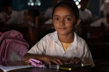 Bluff, Nicaragua. 03-17-2019. Portrait girl looking at the camera studying at school in the town of Bluff in Nicaragua.のeditorial素材