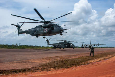 Sandy Bay, Nicaragua. 03-15-2016. Military helicopter returning from reviewing the situation of a community of Puerto Cabezas seriously affected by strong hurricane Felix in the cost of Nicaragua.のeditorial素材
