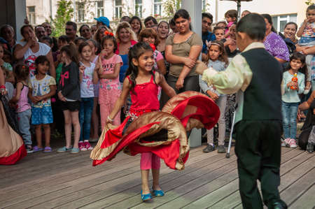 Brno, Czech Republic. 06-11-2016. Girls dancing with traditional costumes at a Festival of Roma people (Gypsies) in Brno attended by people from the community, with activities for children and adolescents.のeditorial素材