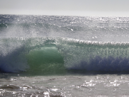 wave breaking on the beachの写真素材
