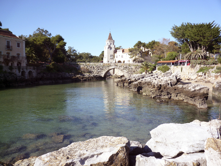 Nice river with a stone bridge in the backgroundの写真素材