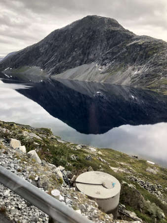 a Mountain reflected into a lakeの写真素材