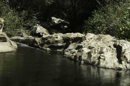 River flowing between the rocks in Madridの写真素材