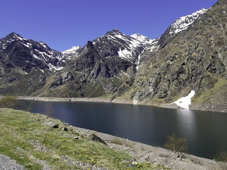 A lake in the snowy mountain in springの写真素材