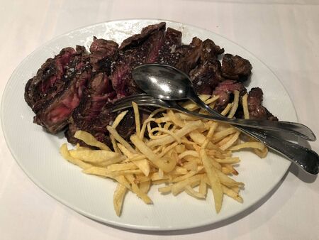 beef tenderloin with french fries close upの写真素材