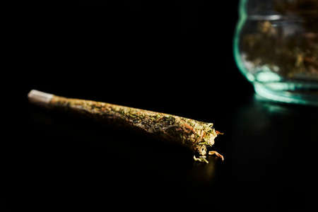 Putting together a Marijuana cigarette.