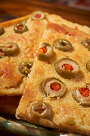Faina Argentina de with stuffed olives.