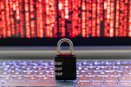 Lock on the keyboard of a laptop with a red stock exchange backgroundの写真素材