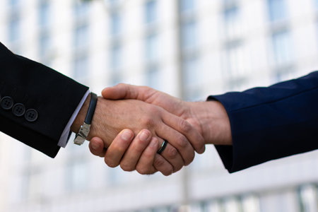 Two businessmen shaking hands, close-up. Business meeting concept.の写真素材
