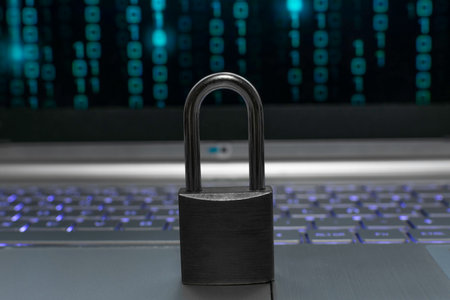 Laptop and padlock on the background of the binary code.の写真素材