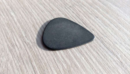 Guitar Ricks Black Pectoral on a Laminate Table for an Electric Guitarの写真素材