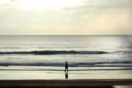 Girl walking on the beach - Agonda Bay, Goaの写真素材
