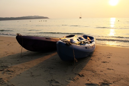 A kayak on the beach during sunset at Koh Kood, Thailandの写真素材