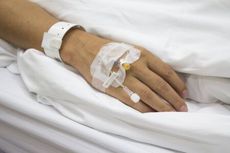 Patient's hand with infusion setの写真素材