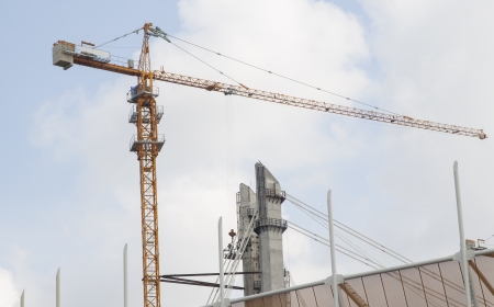 Construction site with crane and heavy machine