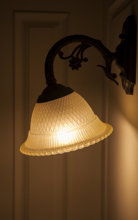 Old fashioned electric lamp on the wallの写真素材