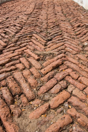 Old brick pathway with rough textureの写真素材