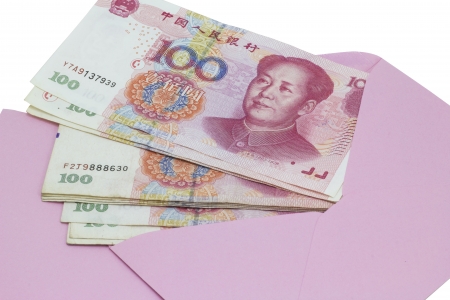 Money in pink envelope for Chinese New Year  isolated on white backgroundの写真素材